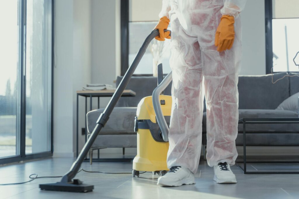 A person with a vacuum