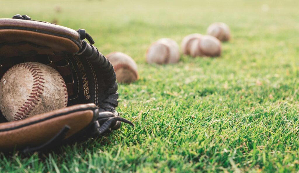 A baseball glove on the grass